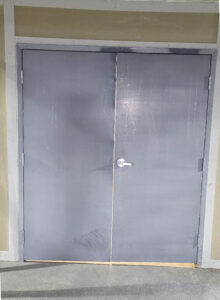 Before - Astragal installation for securing the storage door